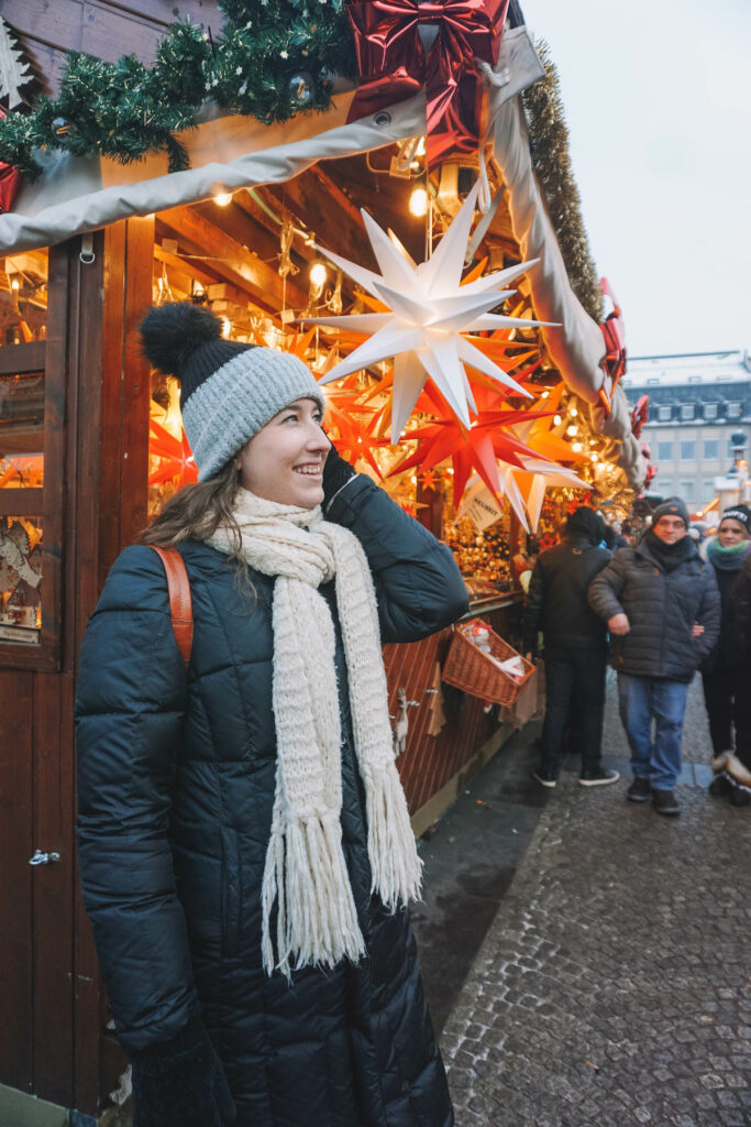 a woman looking away from the camera, at the Bamberg Christmas market 