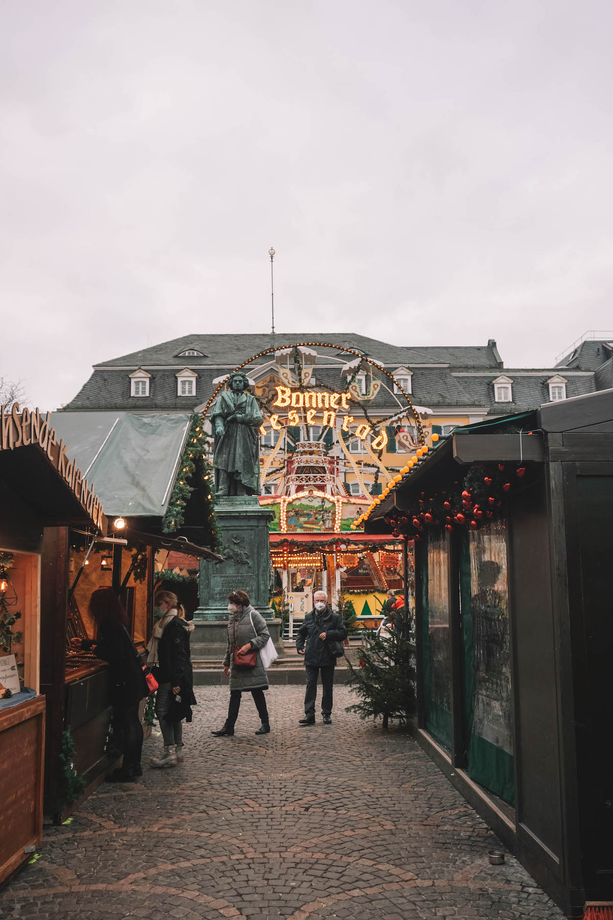 Christmas market stalls in front of the statue of Beethoven at the Bonn, Germany Christmas Market