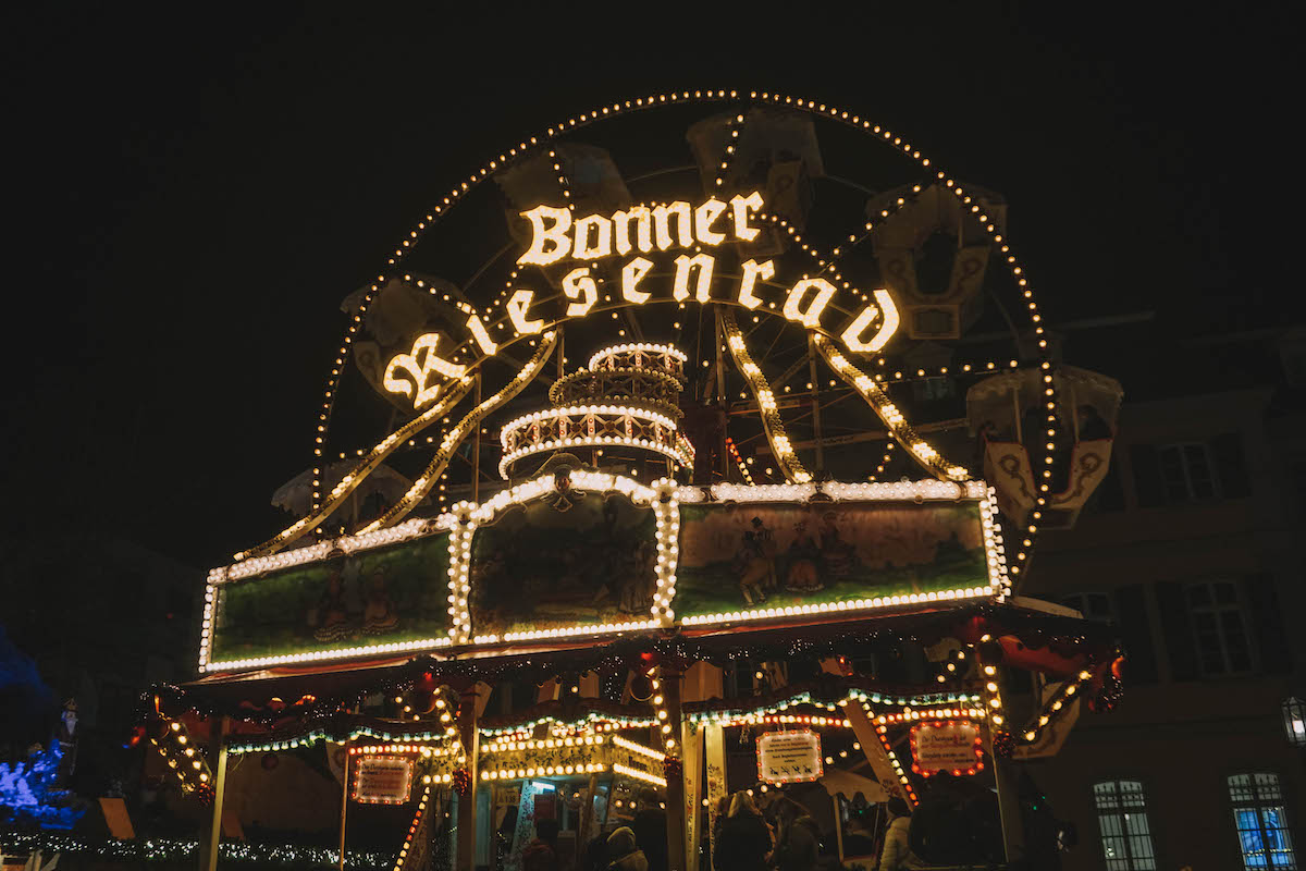 The Ferris wheel at Bonn's Christmas market, lit up at night 