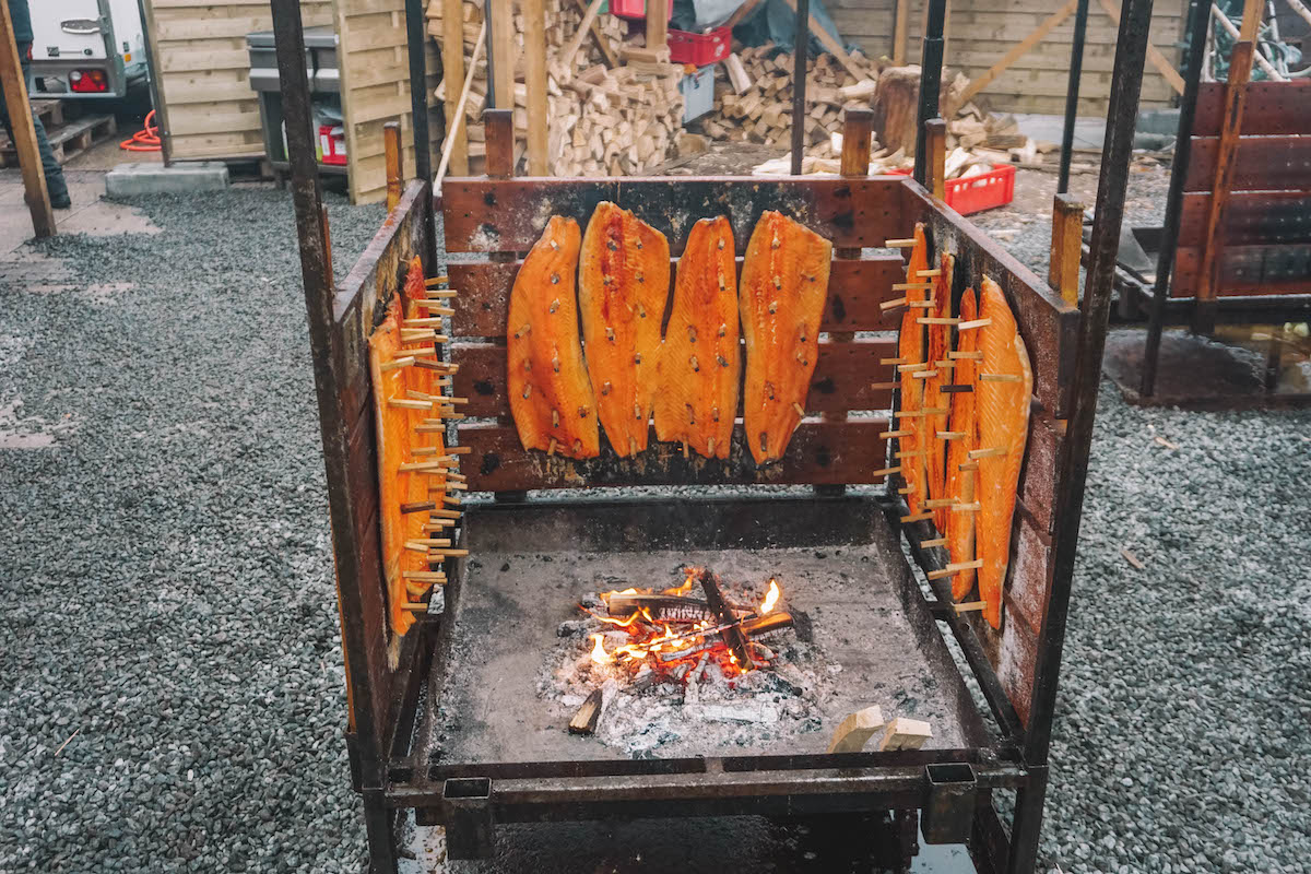 Flammlachs being grilled over a fire