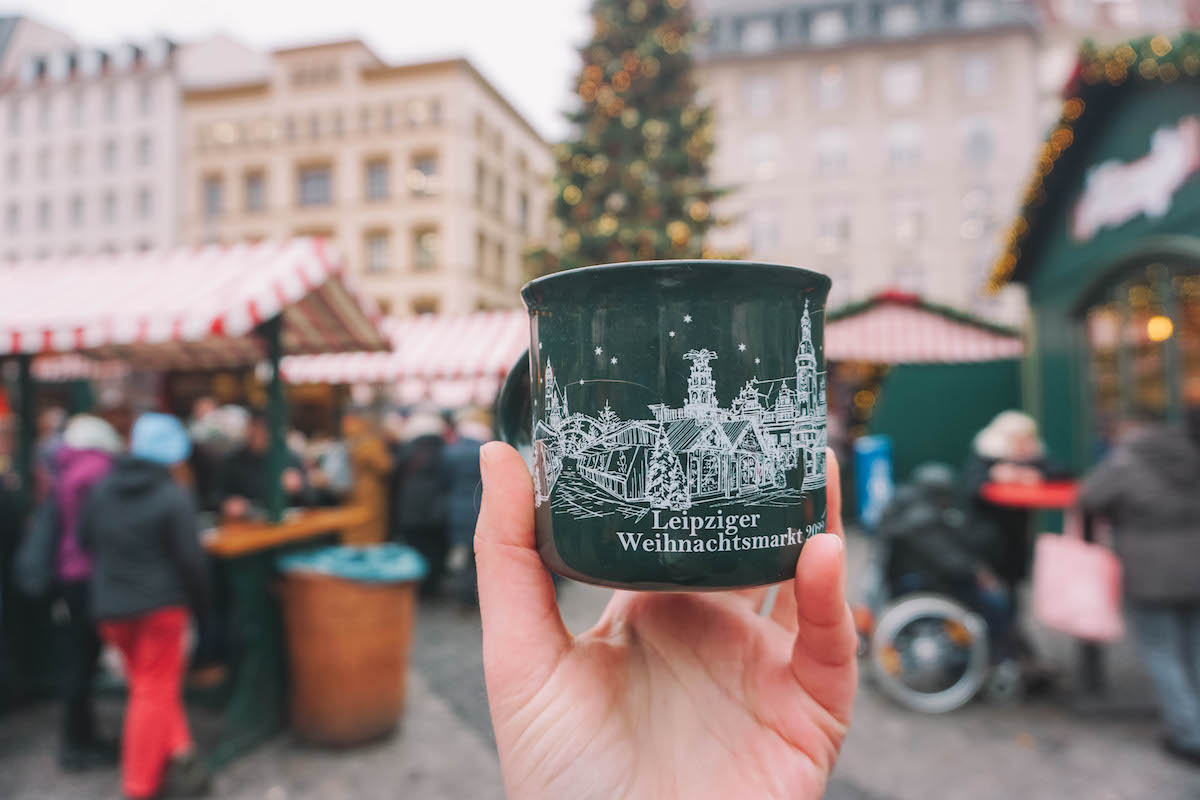 A mug held aloft at Leipzig's Christmas market 