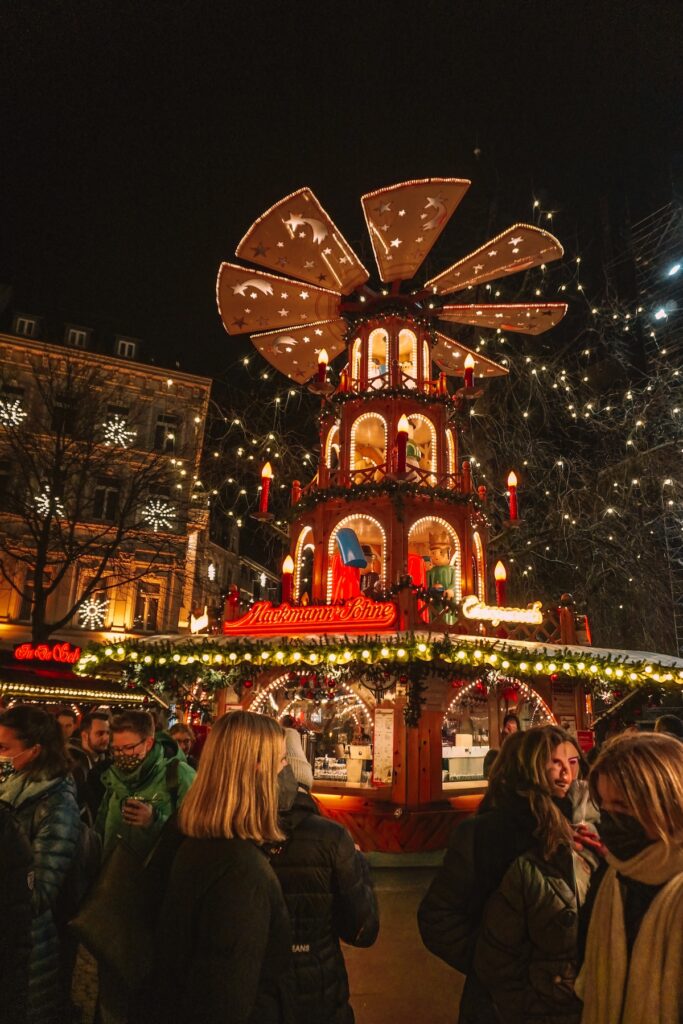 Christmas pyramid at Bonn Christmas Market lit up at night