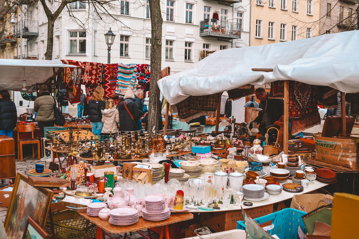 Tables laden with wares at the Arkonaplatz Flea Market in Berlin.