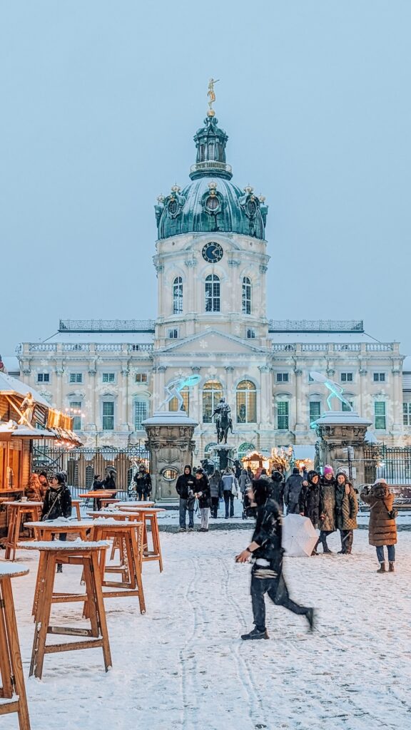 Charlottenburg Palace, in the snow, with Christmas market stalls