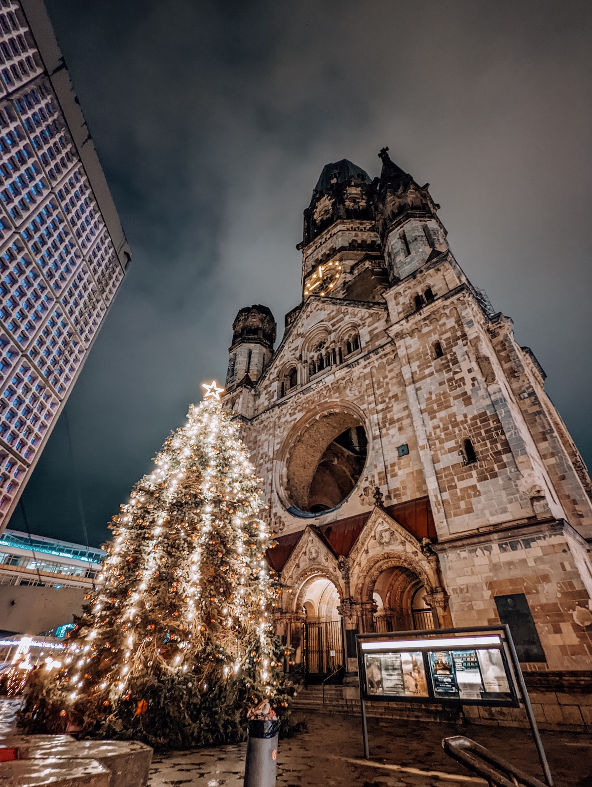 A huge Christmas tree in front of the Kaiser-Wilhelm-Memorial Church in Berlin.