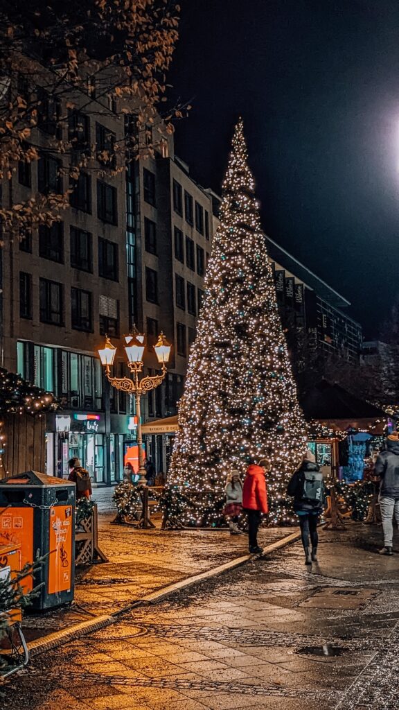 A Christmas tree lit up along Wilmersdorfer Str in Berlin