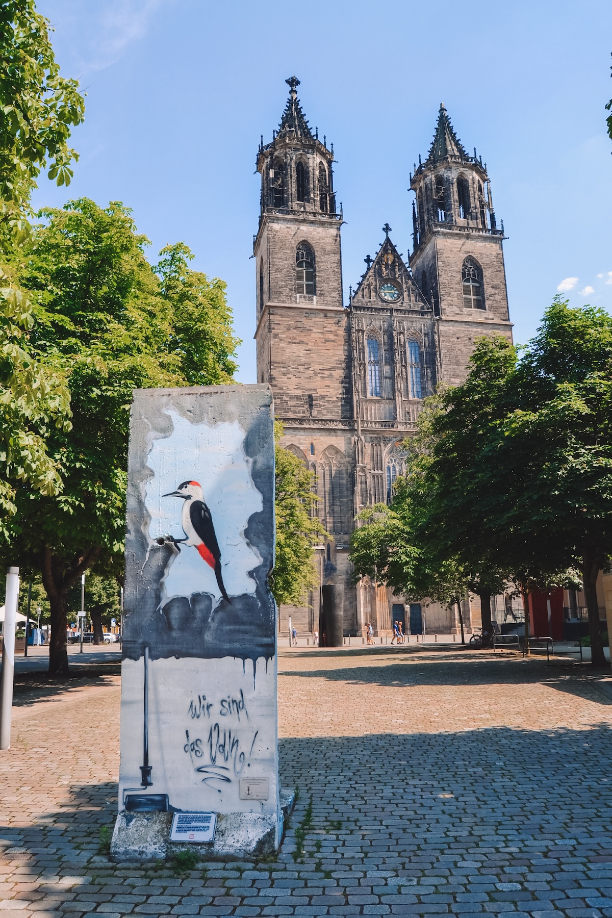 Piece of Berlin Wall in front of the Magdeburg Cathedral