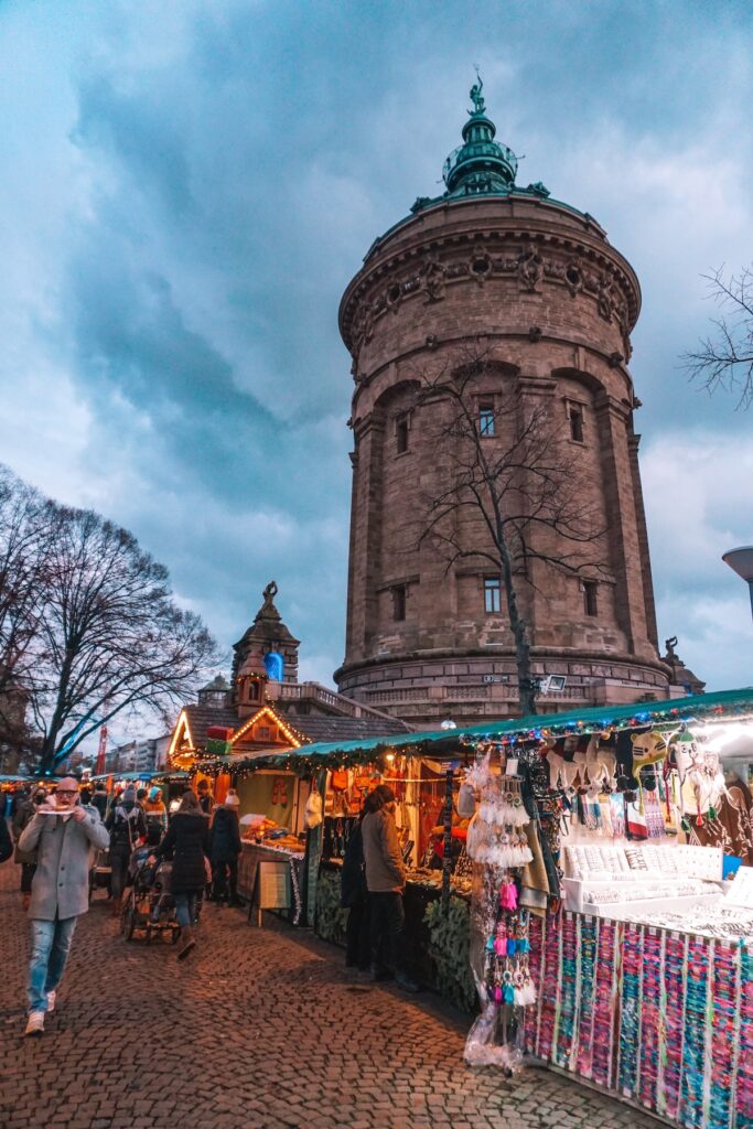 Mannheim water tower, with Christmas market stands around it