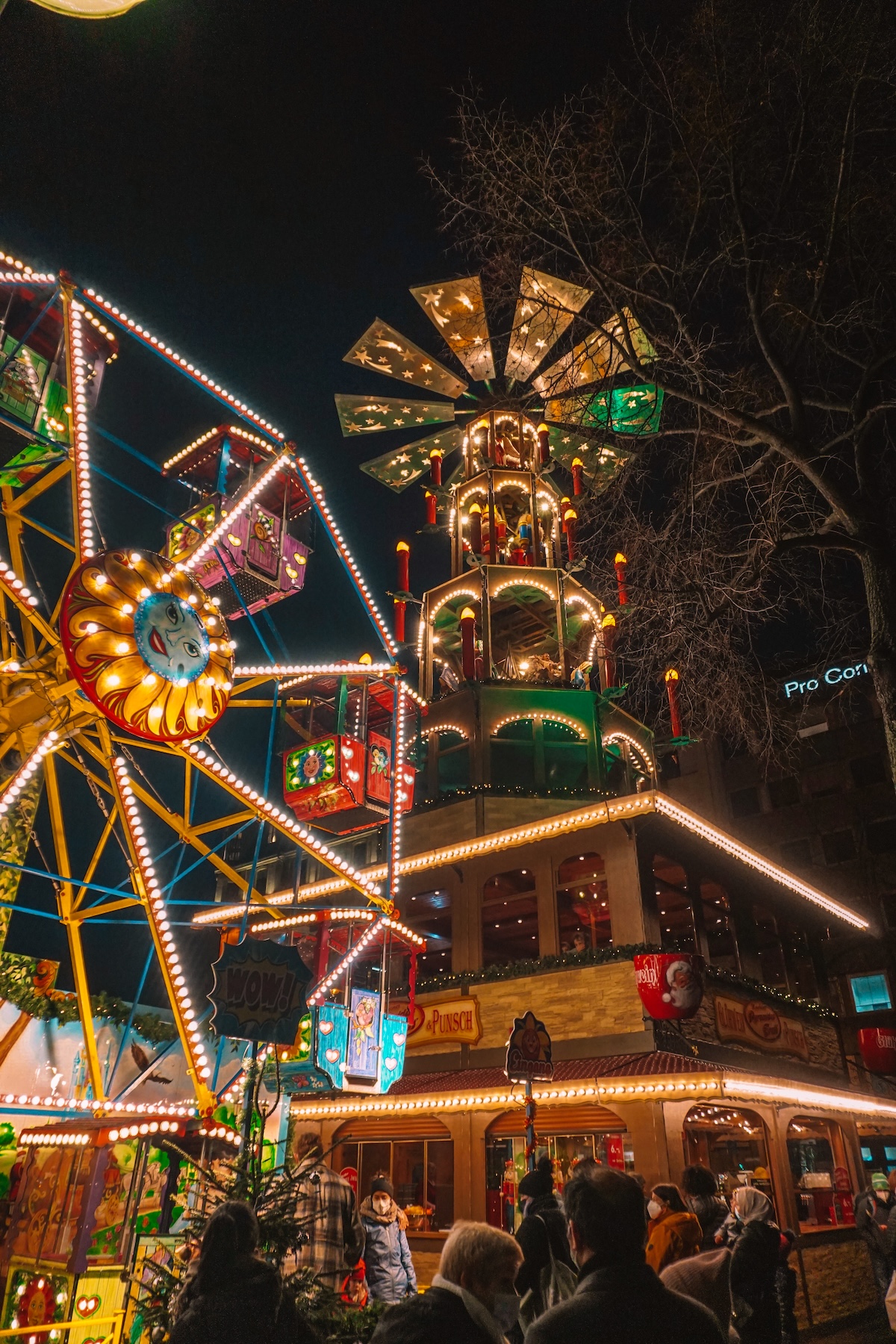 Children's carousel and Christmas pyramid at christmas market