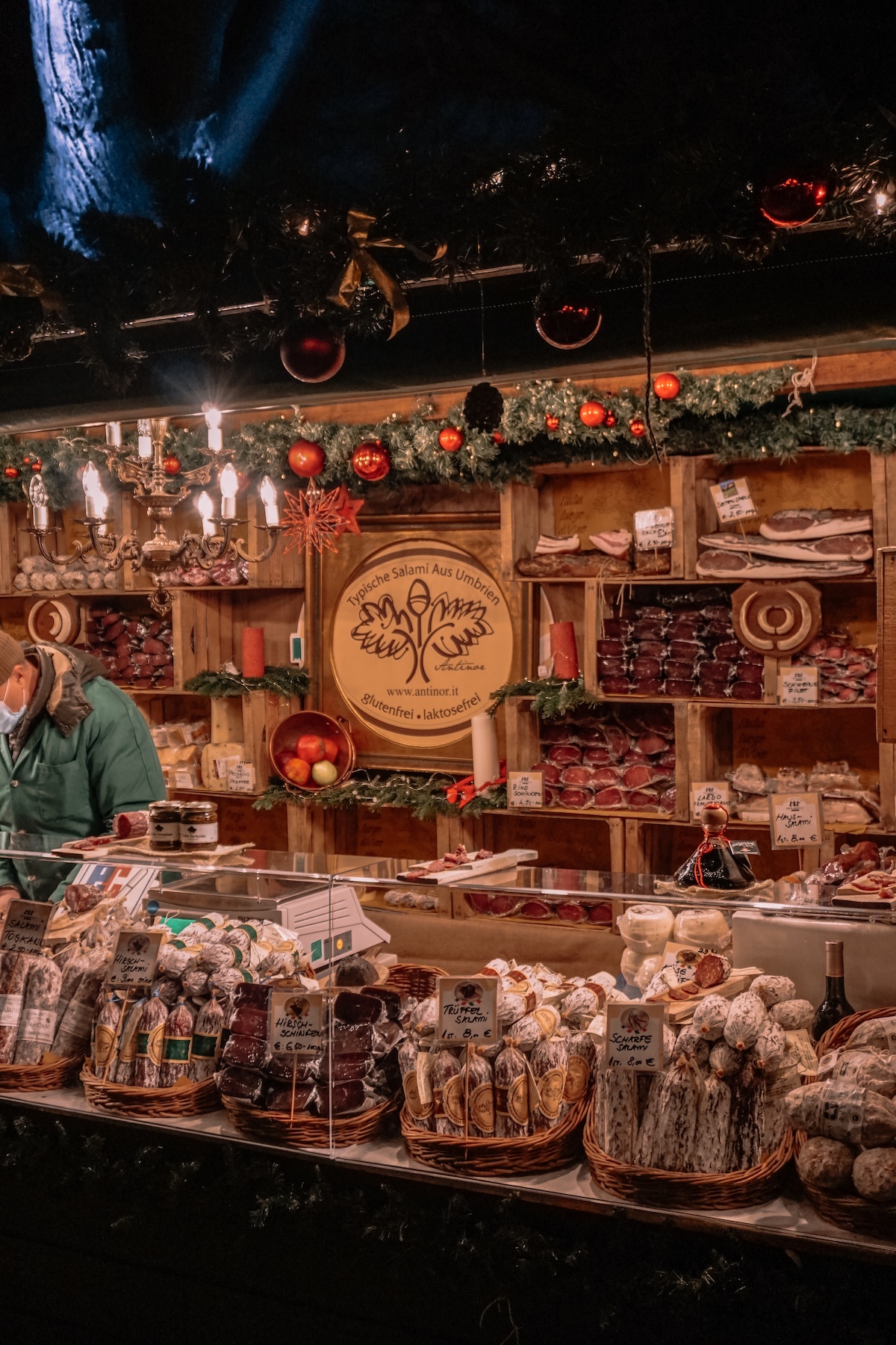 A stall selling salami at a Christmas market