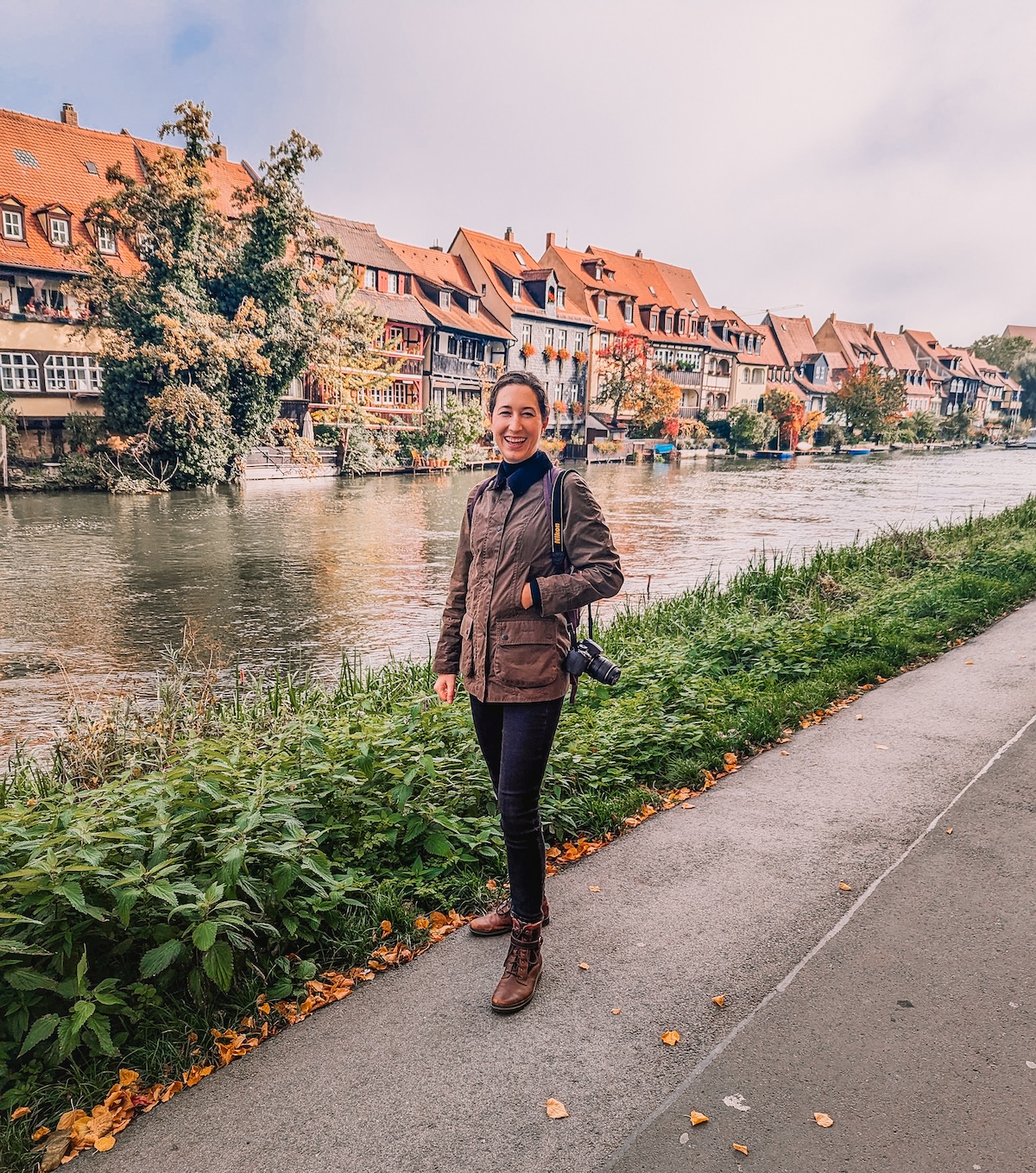 Woman smiling in front of Little Venice in Bamberg