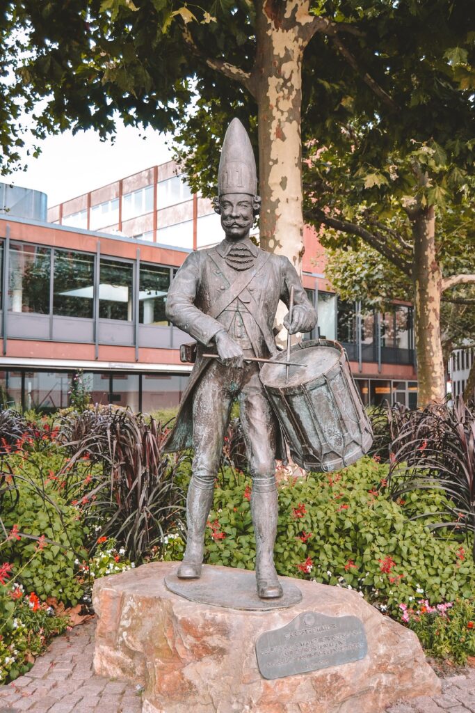 A bronze statute of a drummer