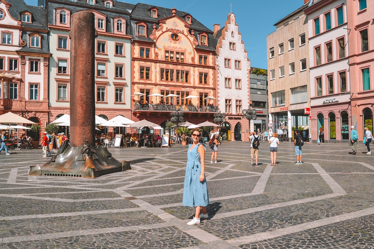 Woman smiling in blue dress at Mainz Marktplatz